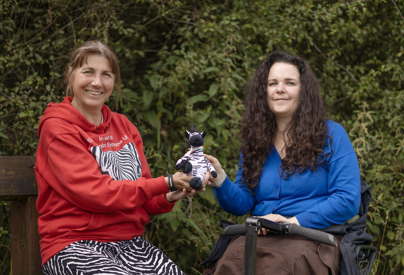 Fran Heley and Cherylee Houston with a zebra, the symbol of the Ehlers-Danlos Support UK charity 