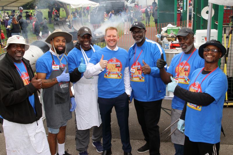 Bristol Street Motors' Phil Rumbles (centre) with Joe Jackson (right) with other volunteers at the event