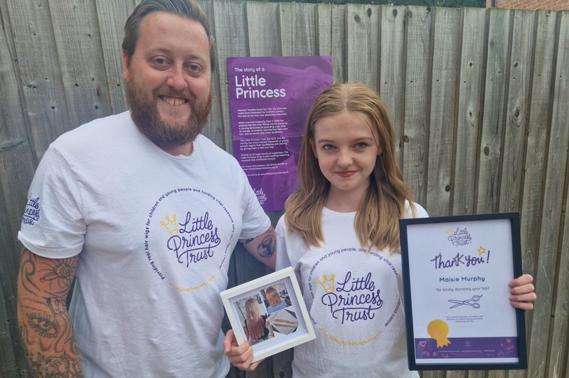 Ryan Penniston with niece Maisie Murphy who donated several inches of her hair to The Little Princess Trust during the charity fun day
