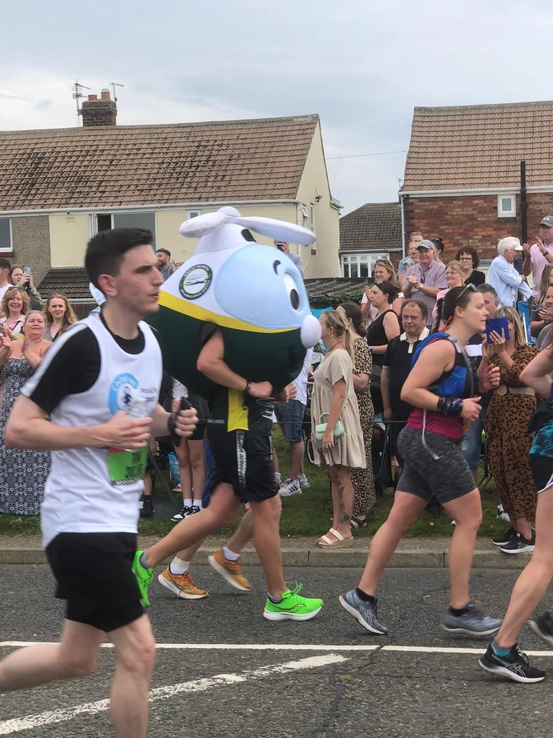 Adam Price running in the helicopter costume