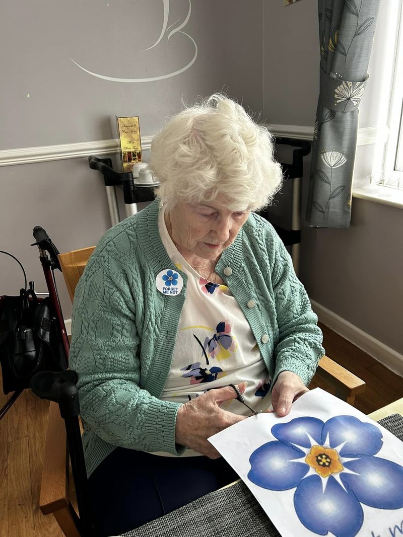 Resident Agnes McEvoy hard at work making the flowers