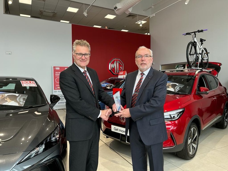 Robert Forrester Chief Executive of Bristol Street Motors (left) presents the award to Franchise Director Andrew Simpson