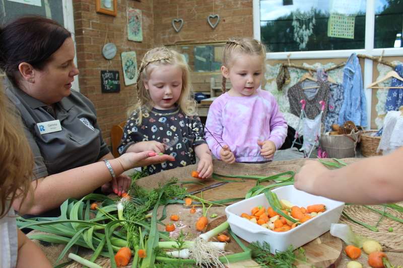 Toddlers from Easterside picking out the veg 