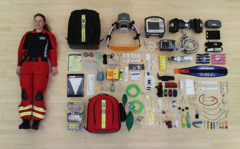 Dr Greta Pells with a kit bag's contents