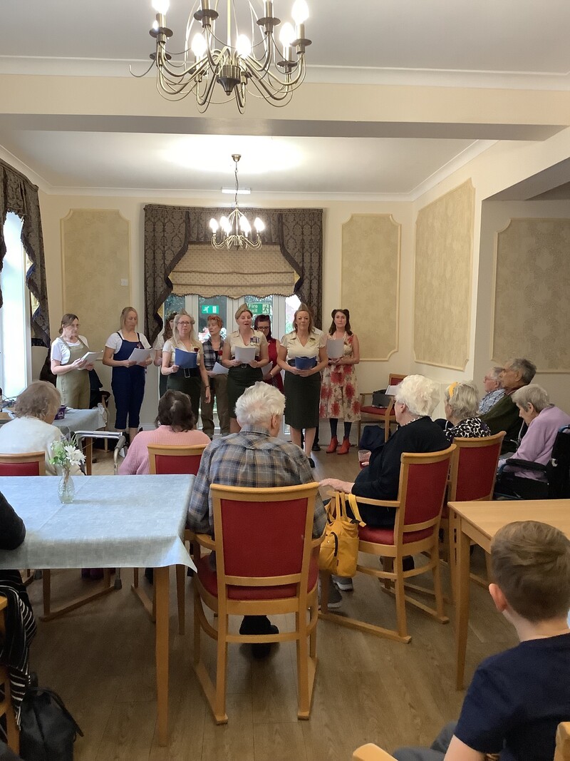 The Weighton choir performing for residents at the Manor House on Remembrance Sunday 
