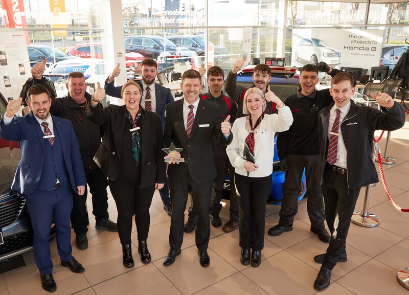 Jamie Davidson, General Manager of Vertu Honda Mansfield celebrates with colleagues