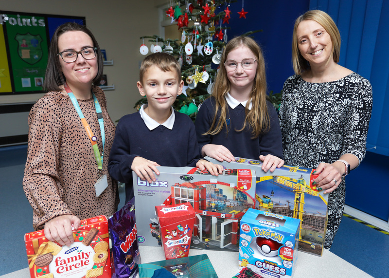 Beyond Housing Community Partnership and Engagement Manager Rachael Crooks (left) pictured with Green Gates Primary School Head Teacher Katie Howe (right) and two of the school pupils.