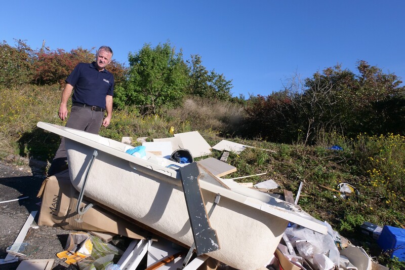 Peter Scott pictured at a previous  fly-tipping incident on Scott Bros land
