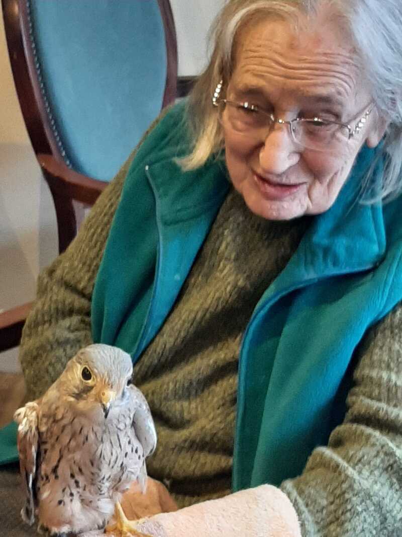 Resident Betty Chambers with one of the birds 