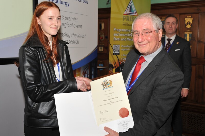 Aimee Hughes receives her scholarship certificate from Dr Stuart Millman at the 7th Postgraduate Research Symposium on Ferrous Metallurgy held in London.