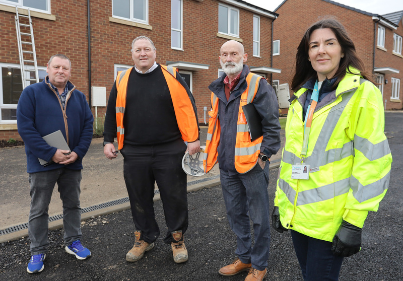 Beyond Housing Senior Project Manager Louise Bentley (right) takes handover of the final completed homes at Hummersea Hills with (from left).. Clerk of Works Adrian Clayton, Esh Contracts Manager Sean Wiles, and Employers Agent Mark Lawton.