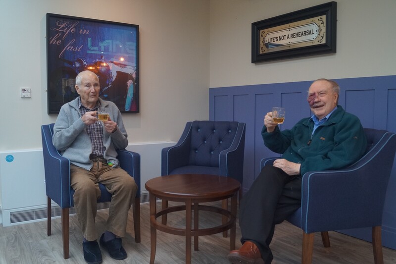 (Left to right) residents Bill, 92, and David, 95, enjoying their first drinks in the new pub. 