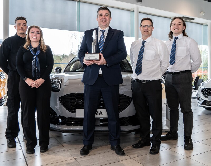 David Howe, General Manager of Bristol Street Motors Kings Norton Ford with team.
